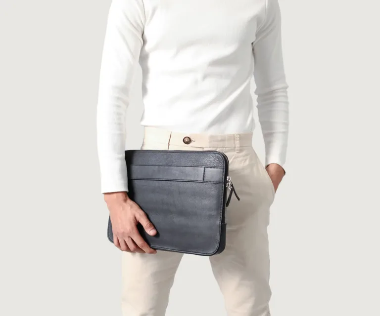 The Baxter Black Leather Laptop Sleeve Luxury Handcrafted Leather Bag — Scale & Carrying Perspective Presentation