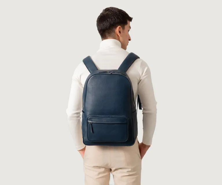 The Philos Midnight Blue Leather Backpack Luxury Handcrafted Leather Bag — Scale & Carrying Perspective Presentation