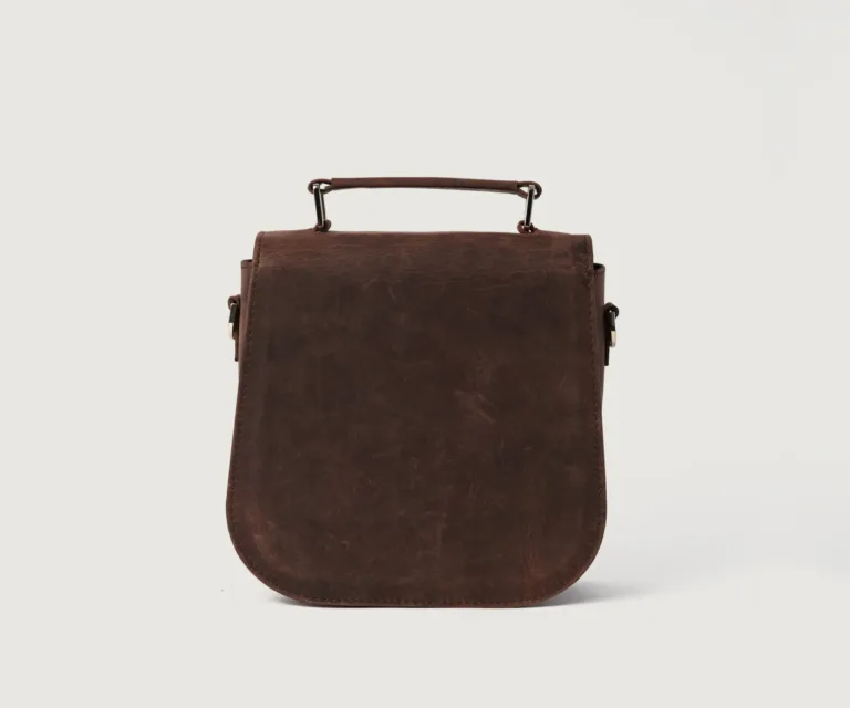 The Sandra Vintage Distressed Brown Leather Saddle Bag Luxury Handcrafted Women's Bag — Scale & Carrying Perspective Presentation